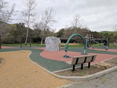 Lafayette community park playground with climbing structures and safety surfacing