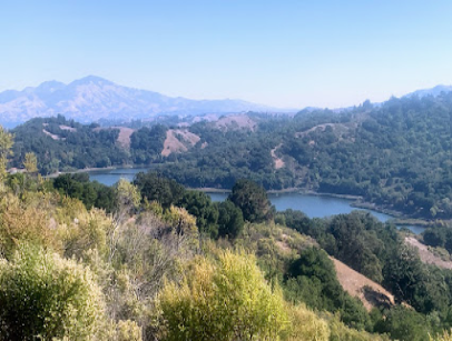 Scenic landscape view of rolling hills, forests, and lakes in the Lafayette area