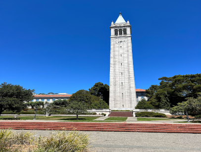 UC Berkeley Campanile bell tower with clear blue sky and landscaped grounds