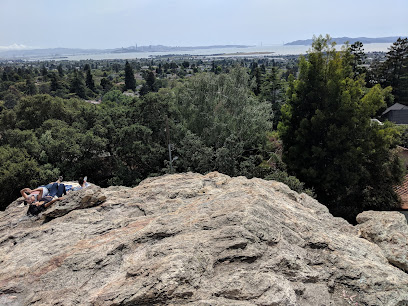 Scenic overlook at Indian Rock with valley and distant hills visible through forested landscape