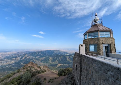 Historic stone tower on Mount Diablo summit with expansive valley views below
